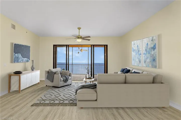 Living area with a ceiling fan, wood finished floors, baseboards, and visible vents