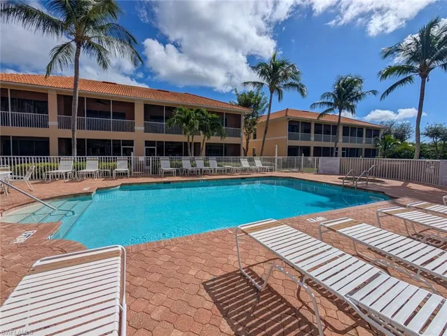 Community pool featuring a patio