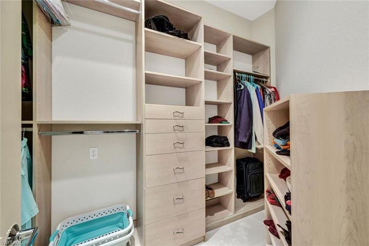 There are 2 Closets in the Primary Suite with custom closet shelving and drawers.