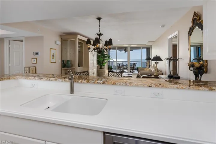 Your View from the Kitchen looking  towards the Great Room and beyond to the GULF!!