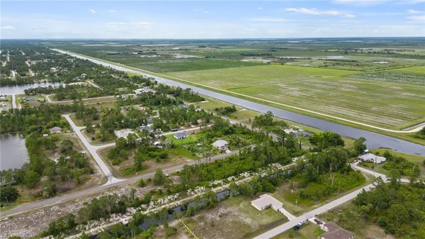 Bird's eye view with a rural view and a water view