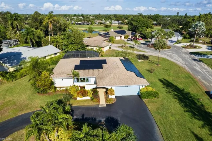 Aerial perspective of suburban area with a large body of water