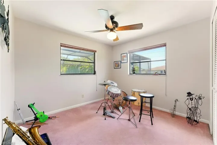 Bedroom, carpet floors, and ceiling fan, multiple window for natural light, celing fan, and closet.