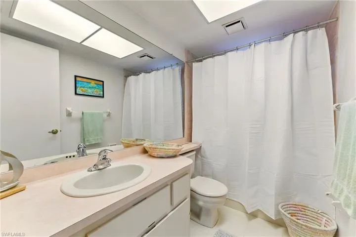 Bathroom with vanity, tile patterned flooring, and a Shower/Bathtub
