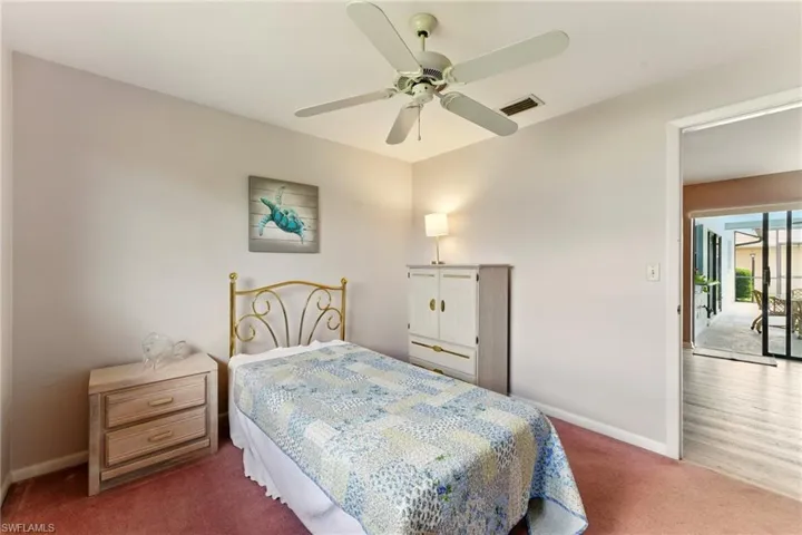 Bedroom featuring  carpet and a ceiling fan