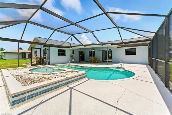 Outdoor pool with screened-in lanai - water fountain - pool needs to be resurfaced