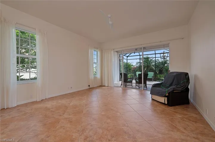 Unfurnished room featuring light tile patterned floors and plenty of natural light