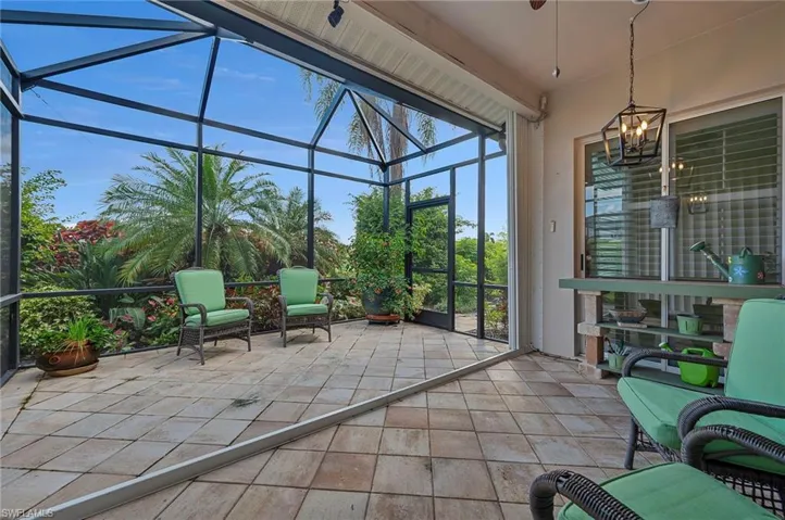 Unfurnished sunroom with an inviting chandelier