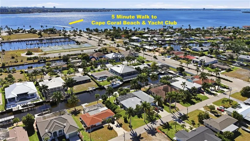 Aerial view of property's location featuring nearby suburban area