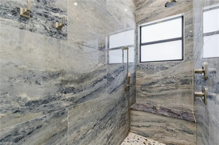 Bathroom with a tile shower