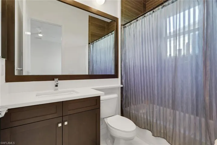 Full bath that connects to one of the bedrooms on the first floor.