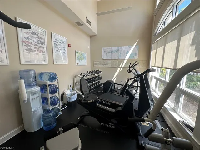 Workout area featuring baseboards