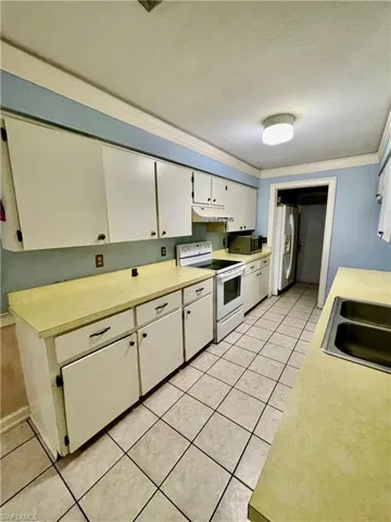 Galley kitchen with plenty of cabinet space.