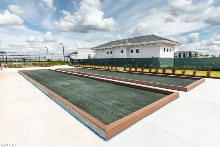 View of pool with a bocce ball area
