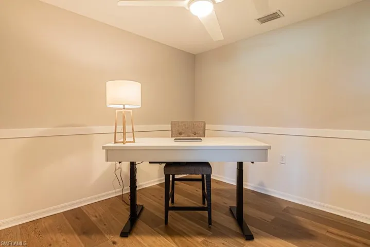 Office space featuring wood finished floors and ceiling fan