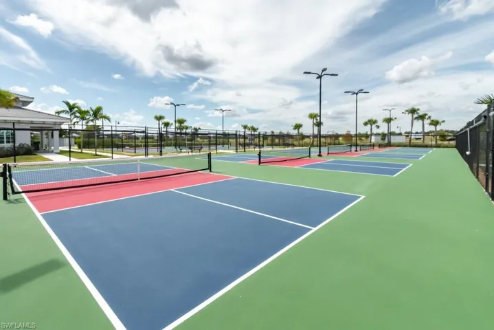 View of tennis court featuring community basketball court