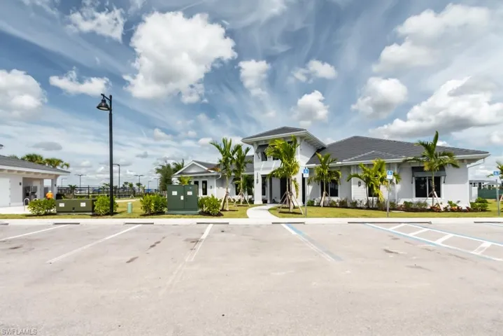 View of property with uncovered parking