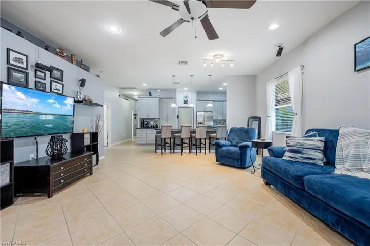 Tiled living room with ceiling fan