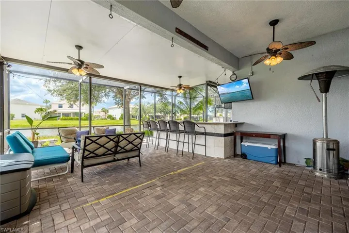 Lanai featuring ceiling fan and a brick pavers