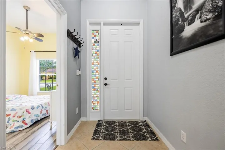 Foyer with tile flooring
