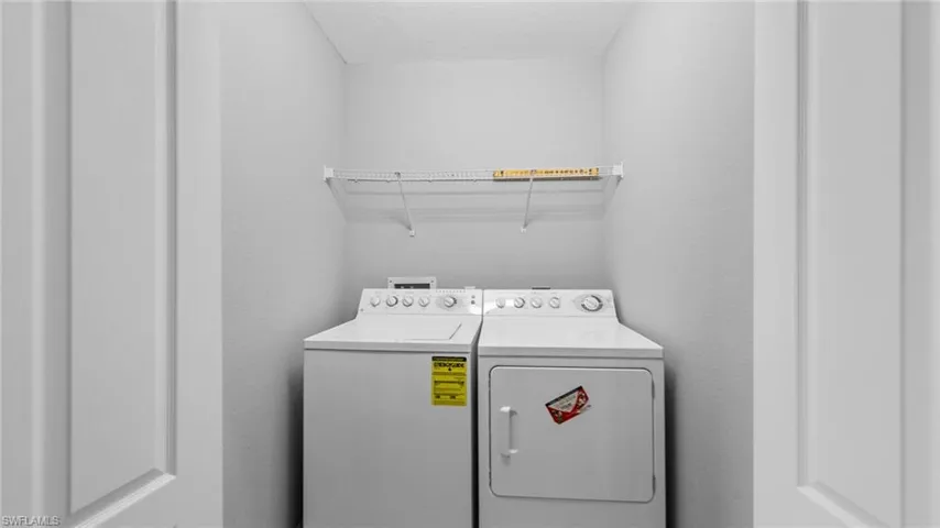 Laundry room featuring separate washer and dryer