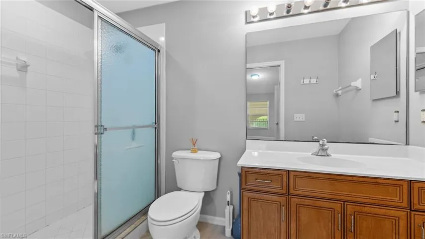 Bathroom with vanity and a stall shower
