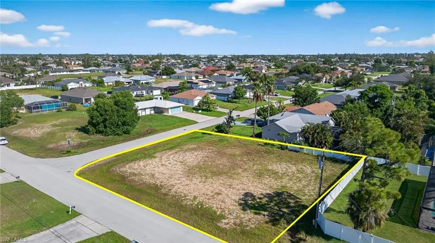 Aerial perspective of suburban area featuring property boundaries highlighted
