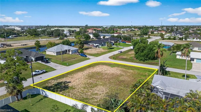 Aerial perspective of suburban area featuring property parcel outlined