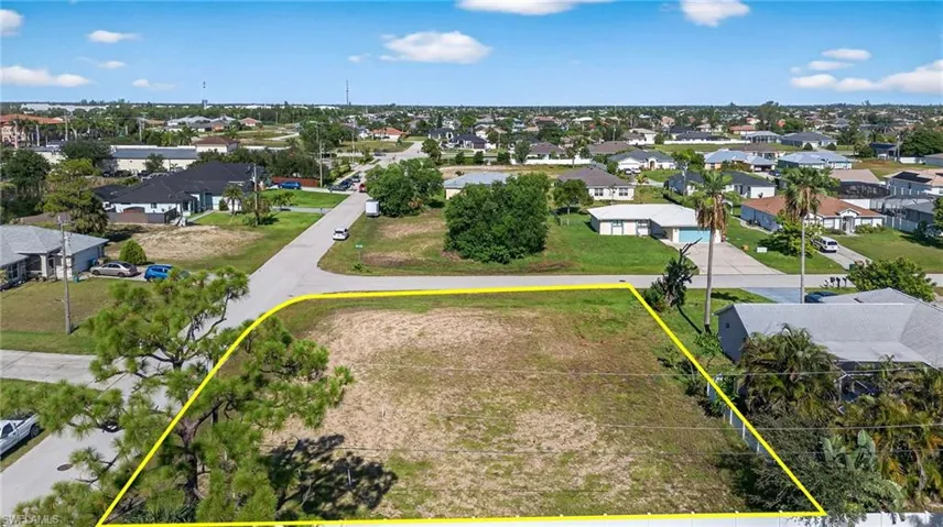Aerial view of residential area with property boundaries highlighted