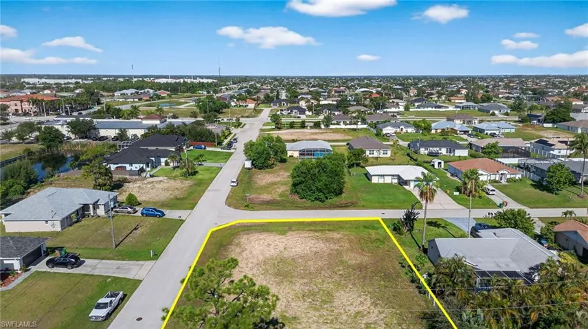Aerial perspective of suburban area featuring property boundaries highlighted