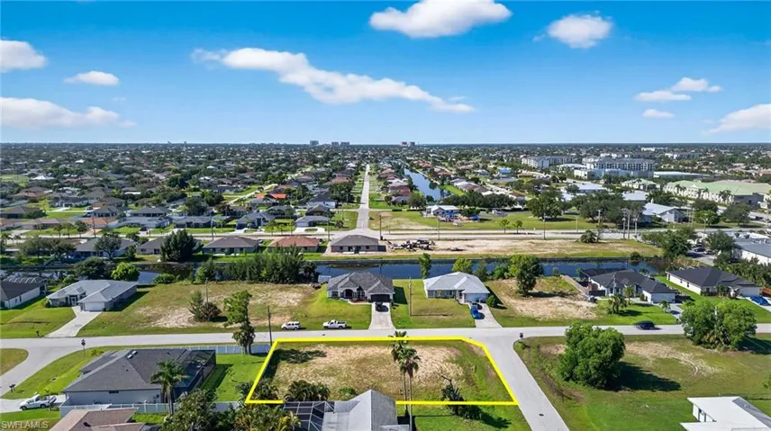 Aerial perspective of suburban area featuring property boundaries highlighted
