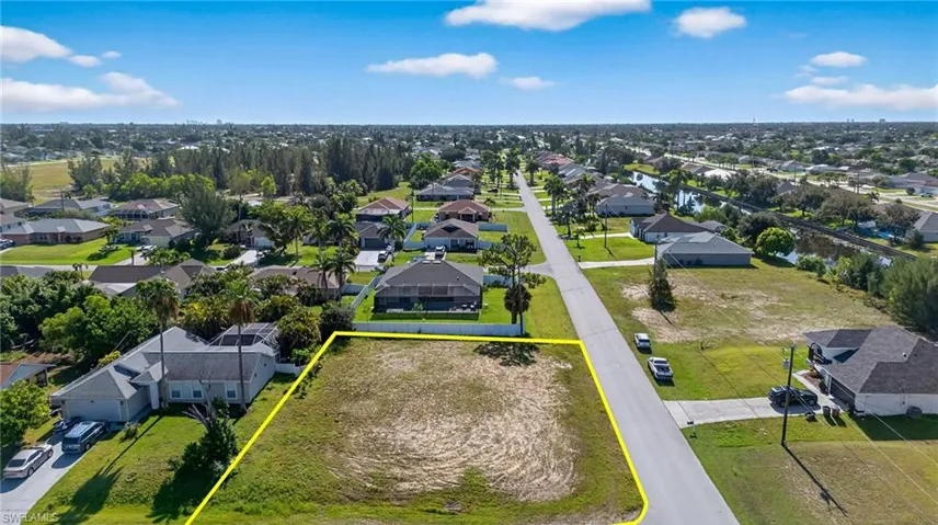 Aerial perspective of suburban area with property parcel outlined
