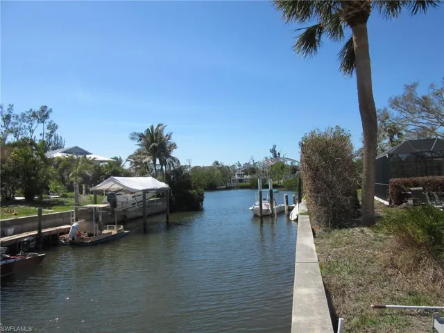 Property view of water featuring a dock