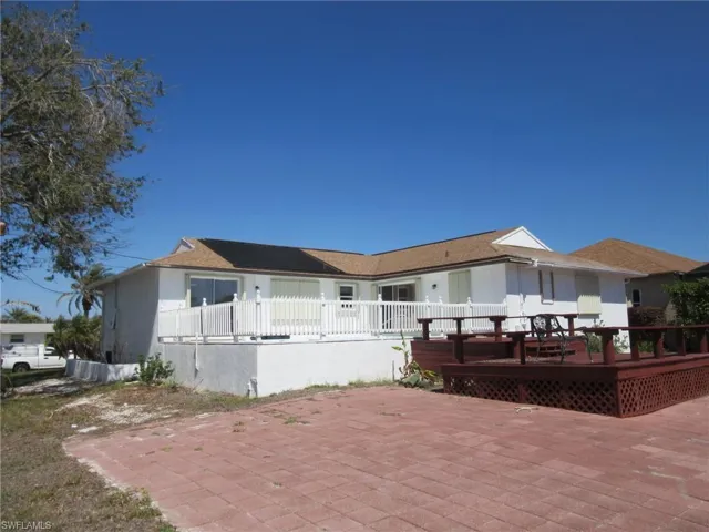 View of front of home featuring a patio and a deck