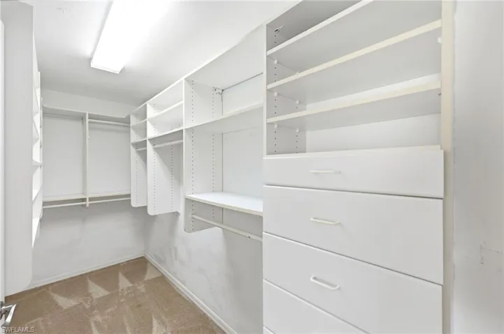 Primary bedroom walk-in California Closet