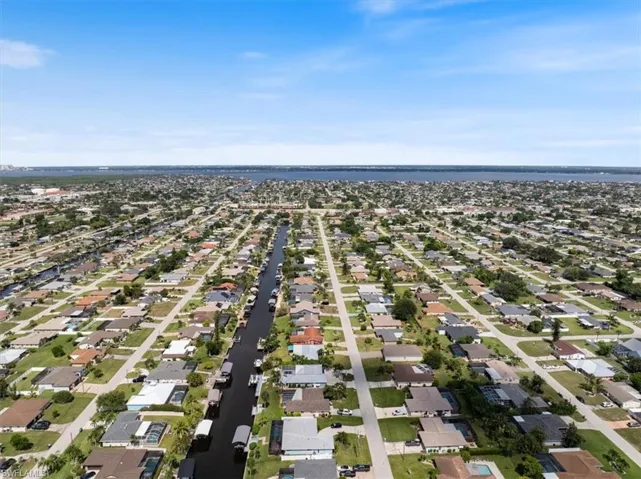 View of property location with nearby suburban area
