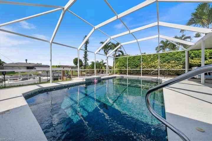 Swimming pool featuring a lanai and a patio area