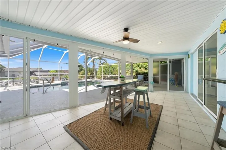 Sunroom with a ceiling fan