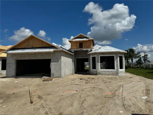 Property under construction featuring a garage