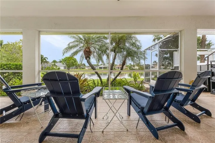 Sunroom / solarium with a water view