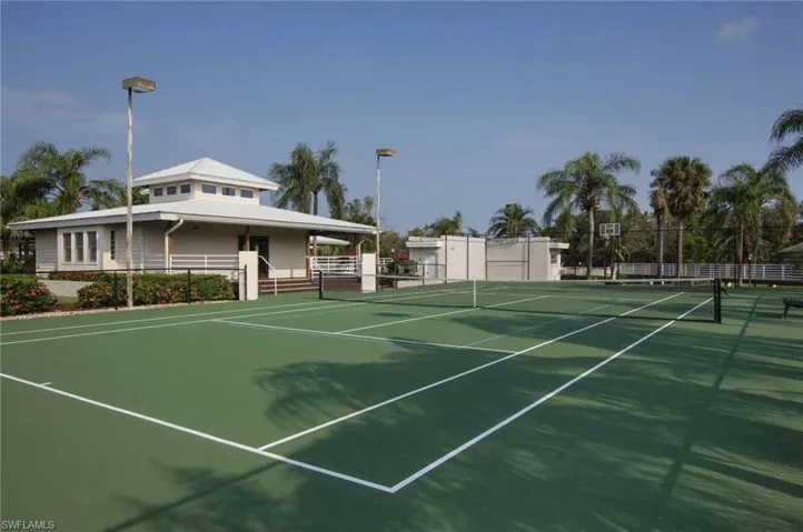 View of tennis court featuring community basketball court