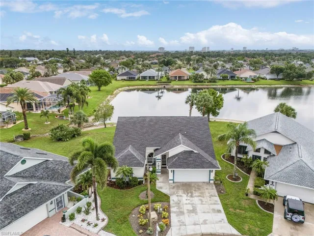Aerial view of residential area with a large body of water