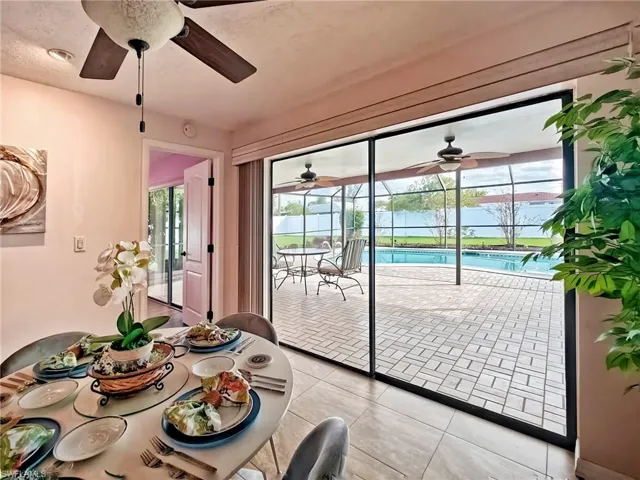 Doorway to outside featuring light tile patterned floors and a wealth of natural light