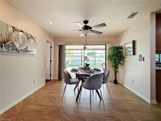 Tiled dining space with ceiling fan
