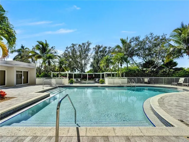 Community pool with a patio