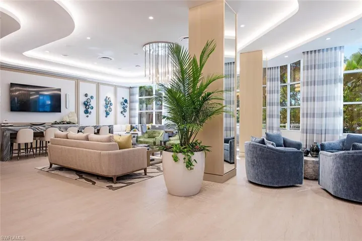 Community lobby featuring expansive windows and recessed lighting