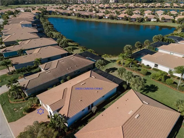 Front view shows large back yard and lake