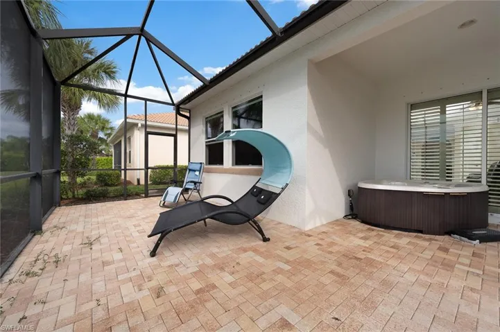 Large back lanai with hot tub, covered seating area, sunning area and room for a pool.Plantation shutters inside the sliding glass doors.