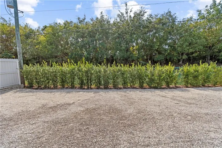 View of backyard completely fenced in