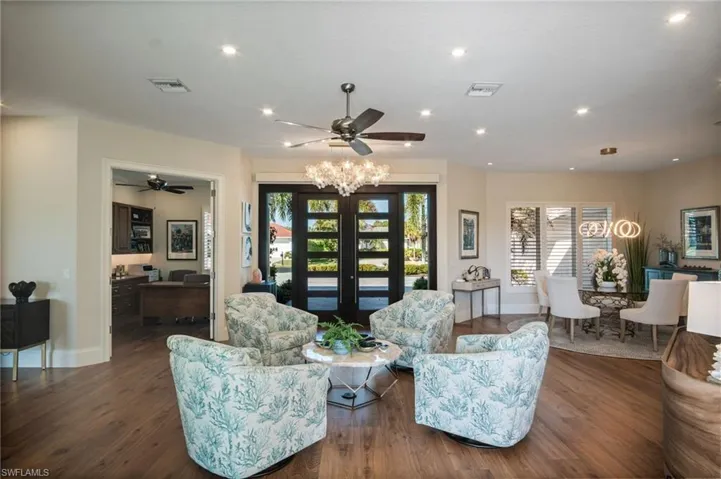 EXPANSIVE and inviting floor plan with HIGH-END HARDWOOD and tile flooring throughout
